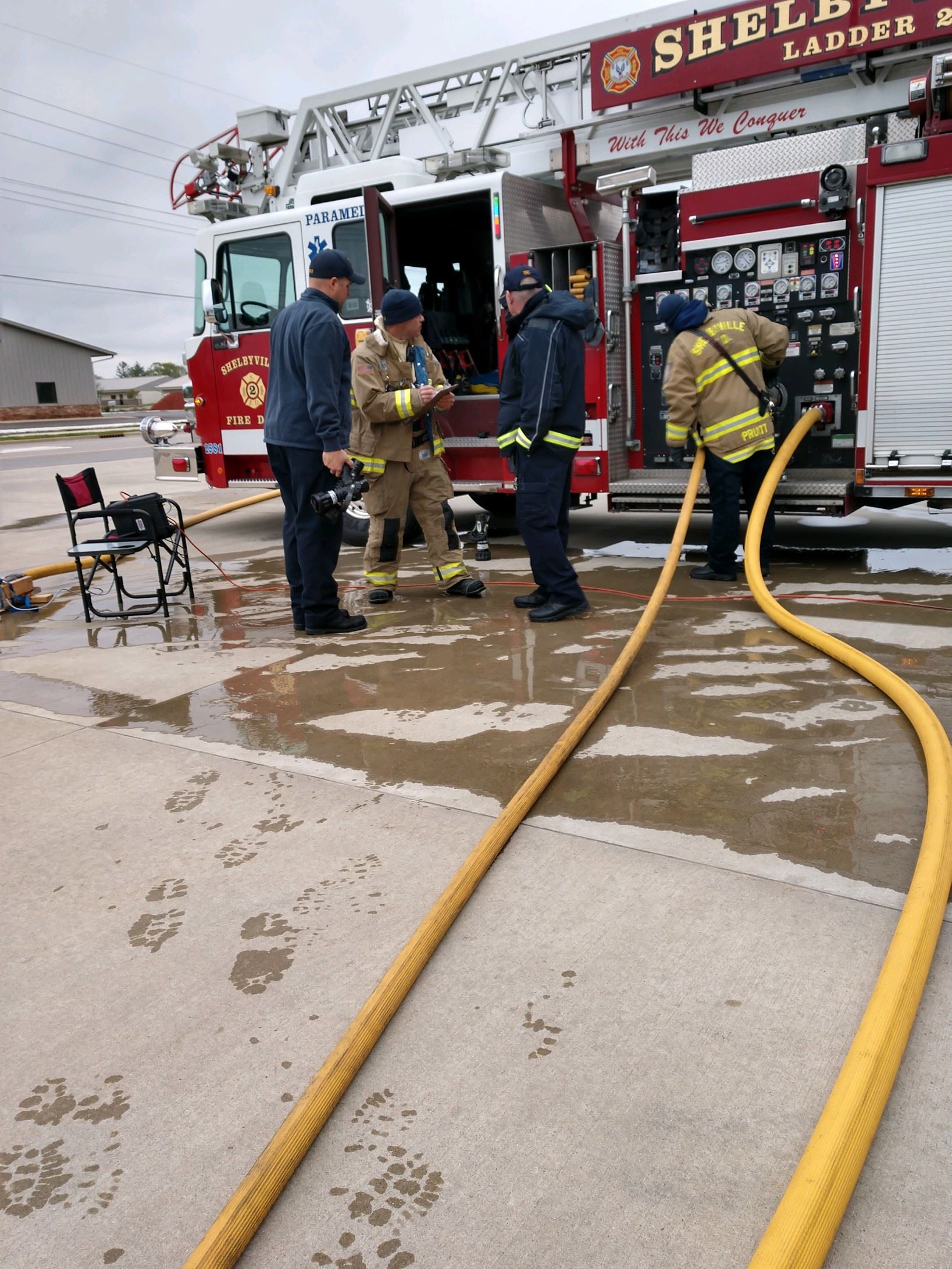 Firefighters Using Yellow Hose 1